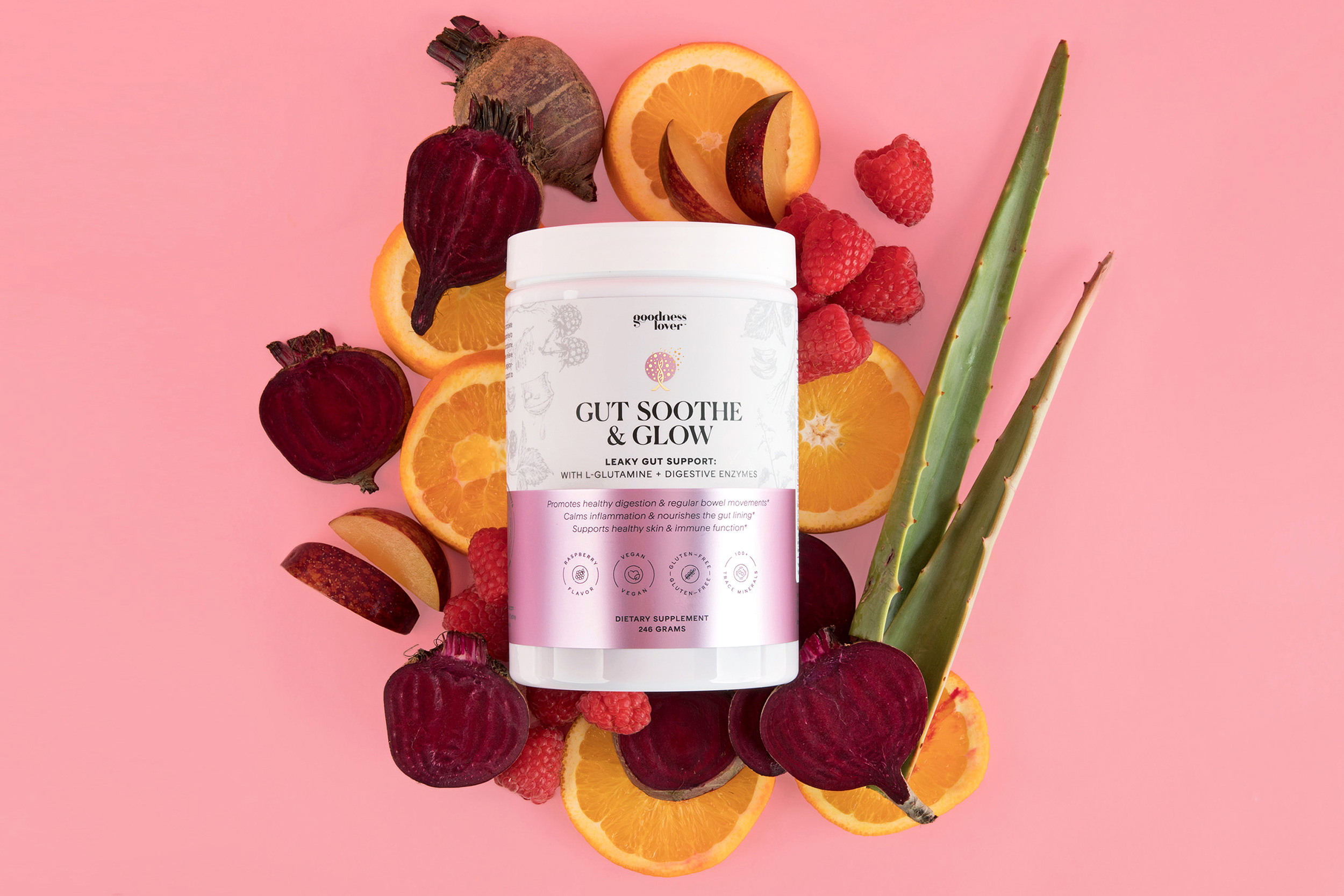 Gut Soothe & Glow surrounded by raspberries, beets, oranges, and aloe